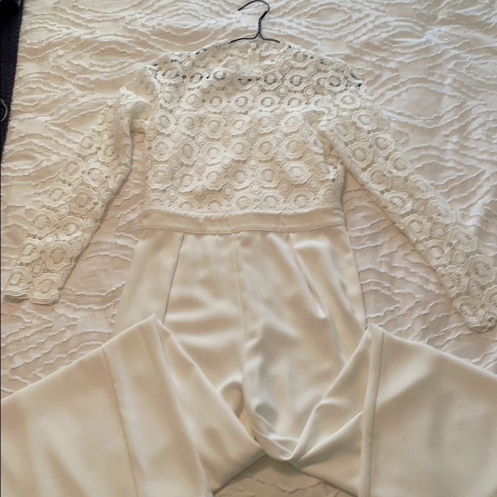 White long sleeve jumpsuit with cutout design